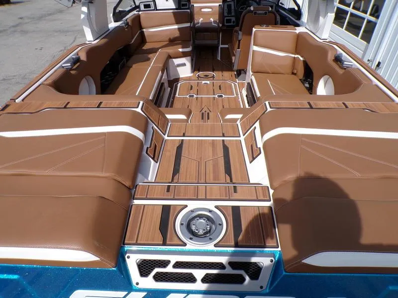Slide: The Image of 2023 Supra SL 450 boat interior with brown and white seating, featuring a stylish deck design. - 22
