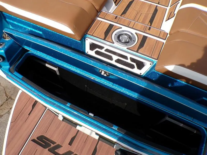 Slide: The Image of 2023 Supra SL 450 boat interior with brown seats and blue accents. - 23