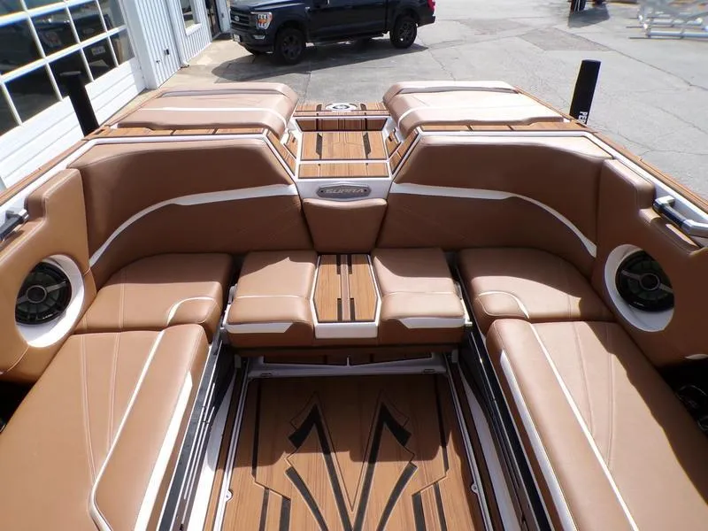 Slide: The Image of 2023 Supra SL 450 boat interior with tan leather seating and wood accents. - 3