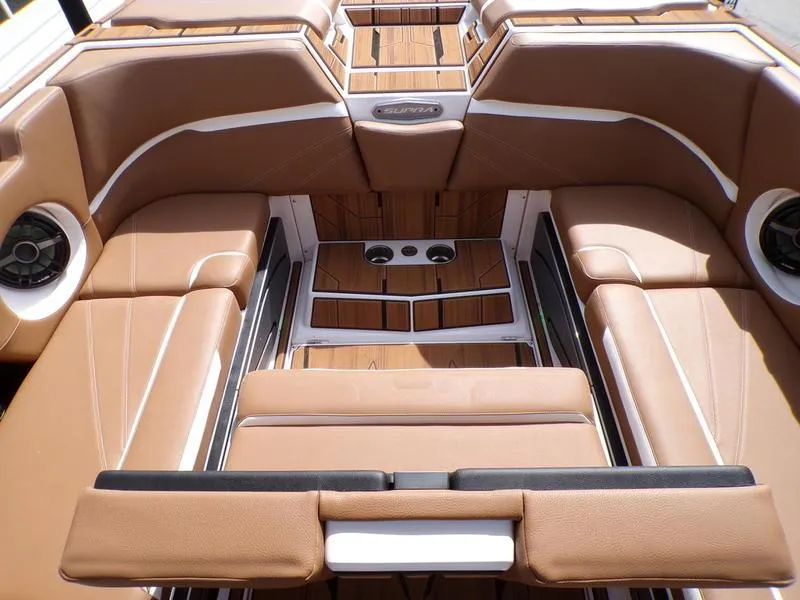 Slide: The Image of Luxurious interior of 2023 Supra SL 450 boat with tan leather seating and wood accents. - 9