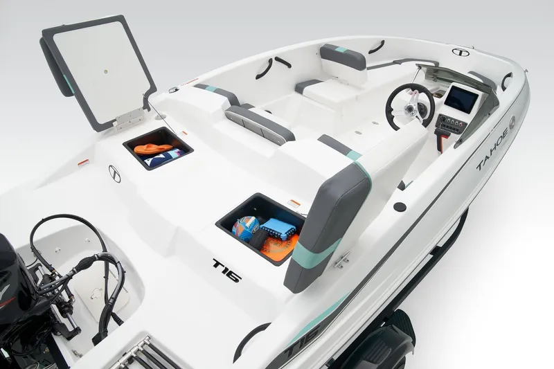 Slide: The Image of 2020 Tracker TAHOE T16 boat interior with storage compartments and steering console. - 11