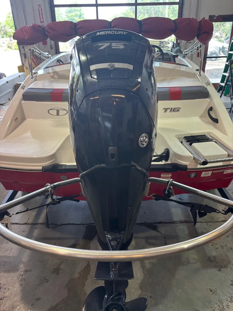 Slide: The Image of 2020 Tracker TAHOE T16 boat with Mercury 75 engine in a garage setting. - 5