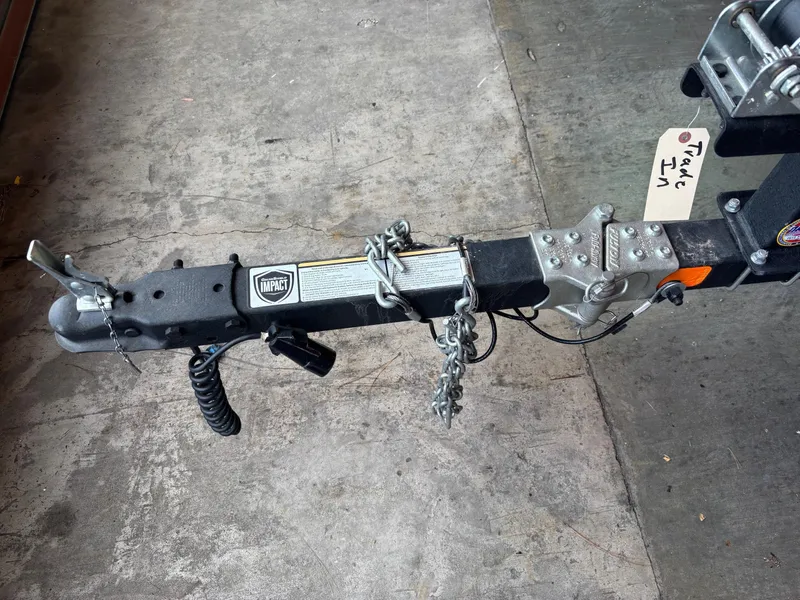 Slide: The Image of Trailer hitch of a 2020 Tracker TAHOE T16 on concrete floor. - 6