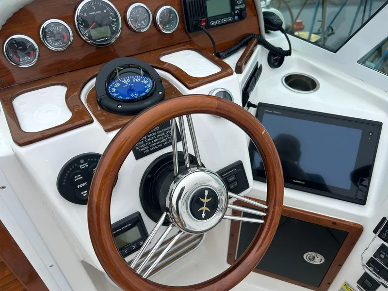 Slide: The Image of Steering wheel and dashboard of 2016 Hunt Yachts Harrier 25 boat. - 4