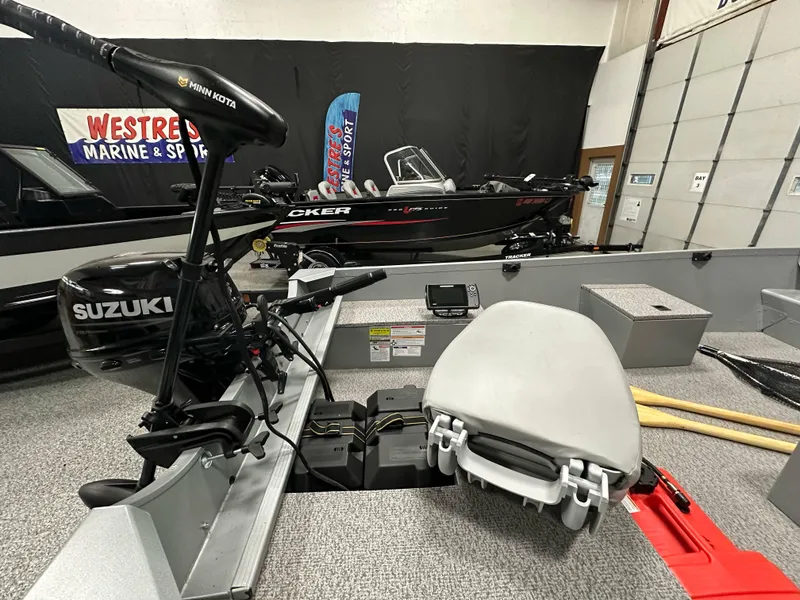 Slide: The Image of 2023 Alumacraft V14 boat interior with Suzuki motor and Minn Kota trolling motor. - 13