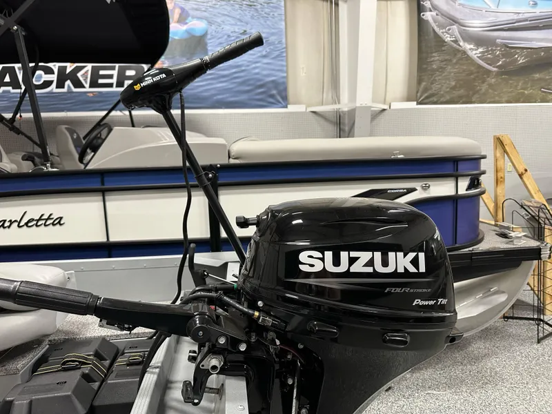 Slide: The Image of 2023 Alumacraft V14 boat with Suzuki outboard motor in showroom. - 19