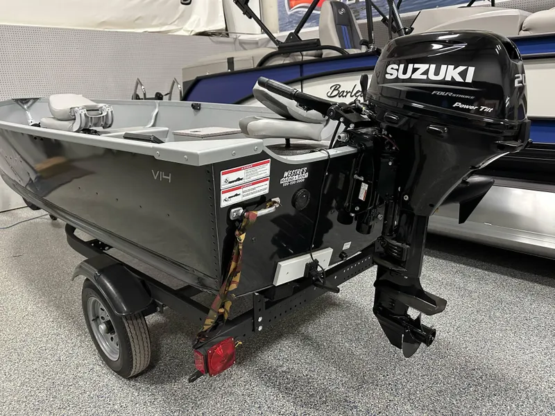 Slide: The Image of 2023 Alumacraft V14 boat with Suzuki outboard motor on a trailer. - 5