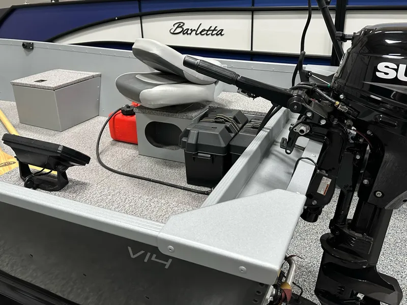 Slide: The Image of 2023 Alumacraft V14 boat interior with motor and seating. - 6