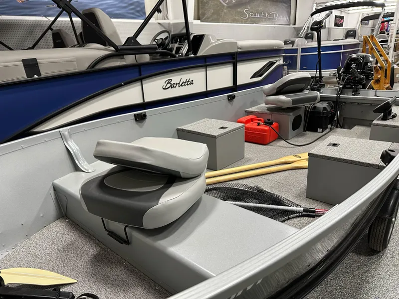 Slide: The Image of 2023 Alumacraft V14 boat interior with seating, storage, and equipment. - 8