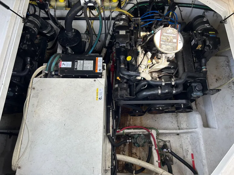 Slide: The Image of Engine compartment of a 2007 Bayliner 305 boat, showcasing mechanical components and wiring. - 15