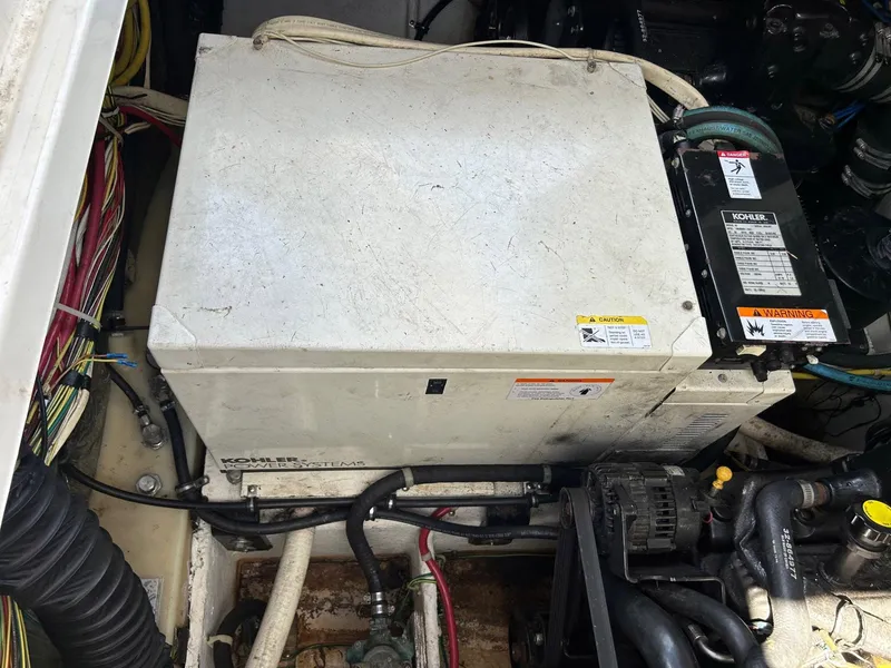 Slide: The Image of Engine compartment of a 2007 Bayliner 305 boat with Kohler generator. - 16