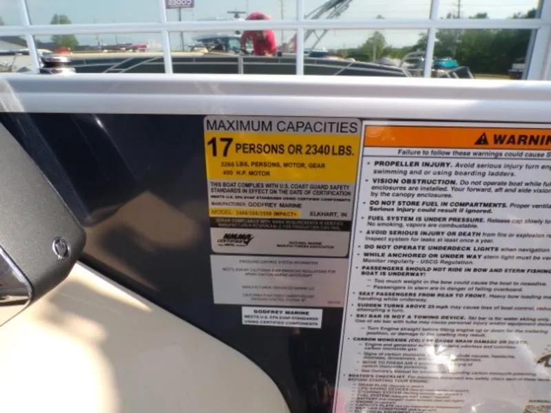 Slide: The Image of 2025 Godfrey Monaco 255 DFL boat capacity label, maximum 17 persons or 2340 lbs. - 17