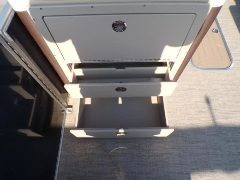 Slide: The Image of Open storage compartment on 2025 Godfrey Monaco 255 DFL boat, showcasing interior space. - 20