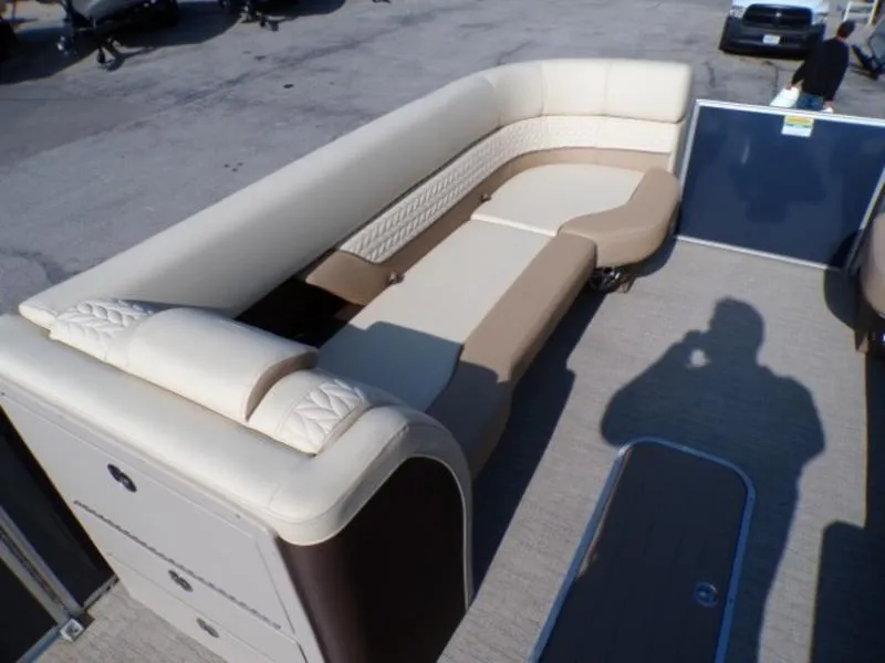Slide: The Image of 2025 Godfrey Monaco 255 DFL boat interior with beige seating and modern design. - 21