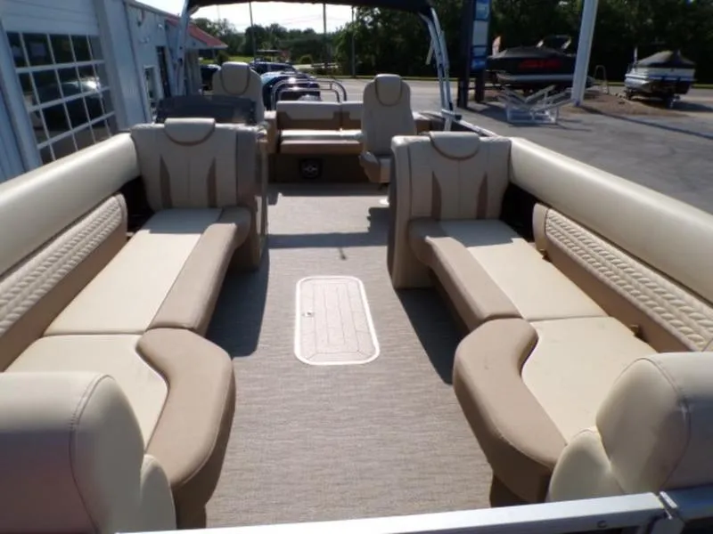 Slide: The Image of 2025 Godfrey Monaco 255 DFL boat interior with beige seating and spacious layout. - 22