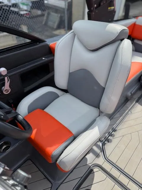 Slide: The Image of 2019 Malibu Wakesetter 22 MXZ boat seat, gray and orange upholstery, modern design. - 10