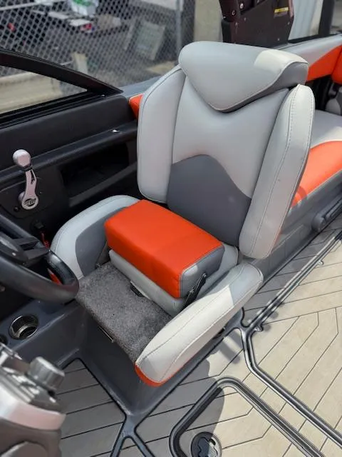 Slide: The Image of 2019 Malibu Wakesetter 22 MXZ interior with gray and orange seating. - 11