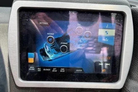 Slide: The Image of Touchscreen display of a 2019 Malibu Wakesetter 22 MXZ boat showing settings and controls. - 16