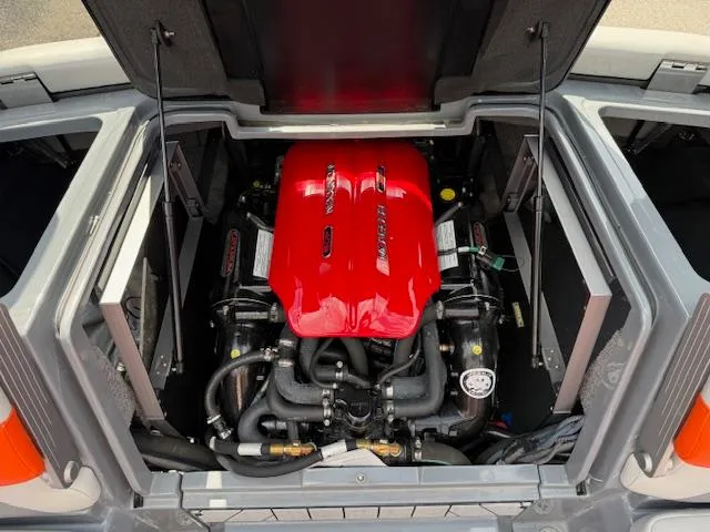 Slide: The Image of 2019 Malibu Wakesetter 22 MXZ engine compartment with red engine cover. - 19