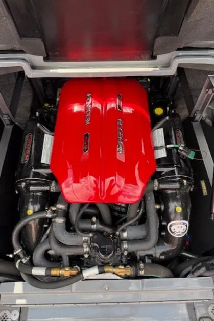 Slide: The Image of 2019 Malibu Wakesetter 22 MXZ engine with red cover and black components. - 20