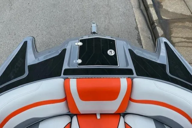 Slide: The Image of 2019 Malibu Wakesetter 22 MXZ boat with orange and white seating, viewed from above. - 4