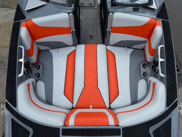 Slide: The Image of 2019 Malibu Wakesetter 22 MXZ interior with orange and gray seating. - 7