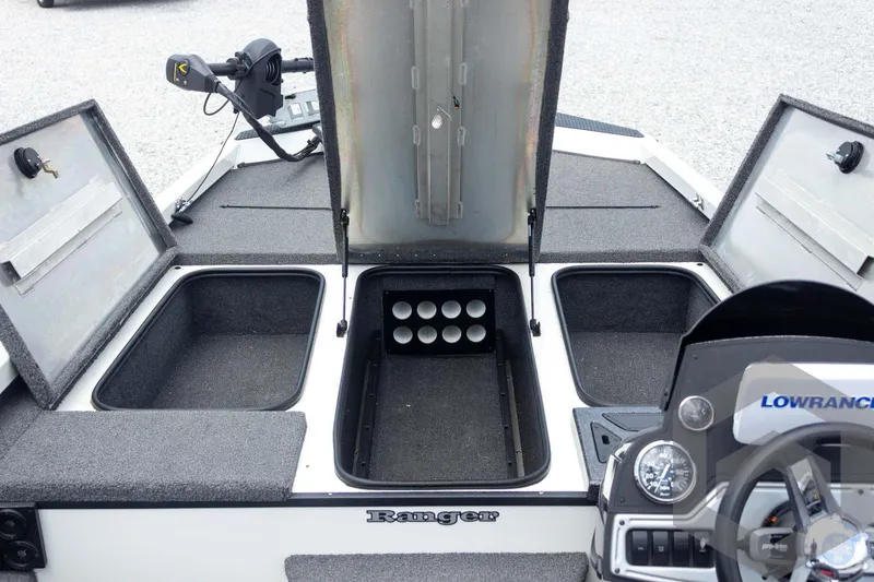 Slide: The Image of 2019 Ranger RT188 boat interior with open storage compartments and Lowrance electronics. - 20