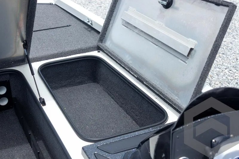 Slide: The Image of 2019 Ranger RT188 boat storage compartment with open lid, showcasing spacious interior. - 23