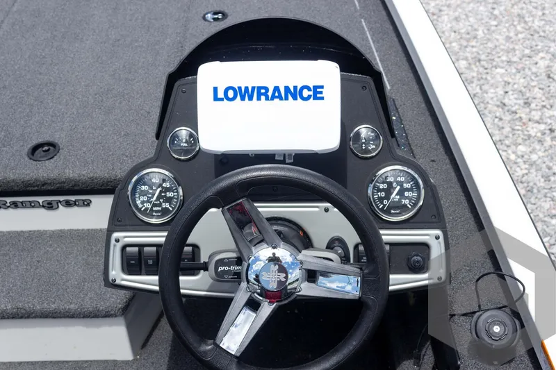 Slide: The Image of 2019 Ranger RT188 boat dashboard with Lowrance display and steering wheel. - 26