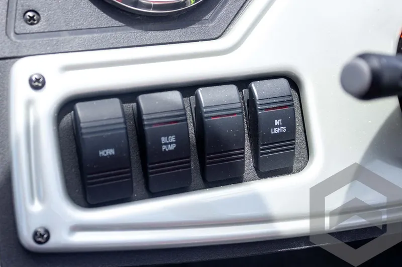 Slide: The Image of Control panel of a 2019 Ranger RT188 boat with switches for horn, bilge pump, and lights. - 27
