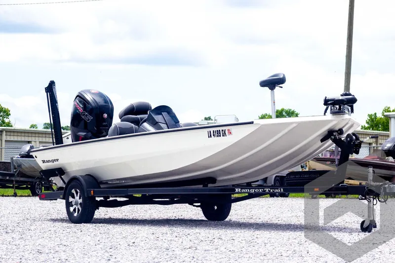 Slide: The Image of 2019 Ranger RT188 boat on trailer, parked outdoors, featuring sleek design and powerful engine. - 3