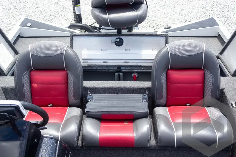 Slide: The Image of 2019 Ranger RT188 boat interior with red and gray seats, steering wheel visible. - 32