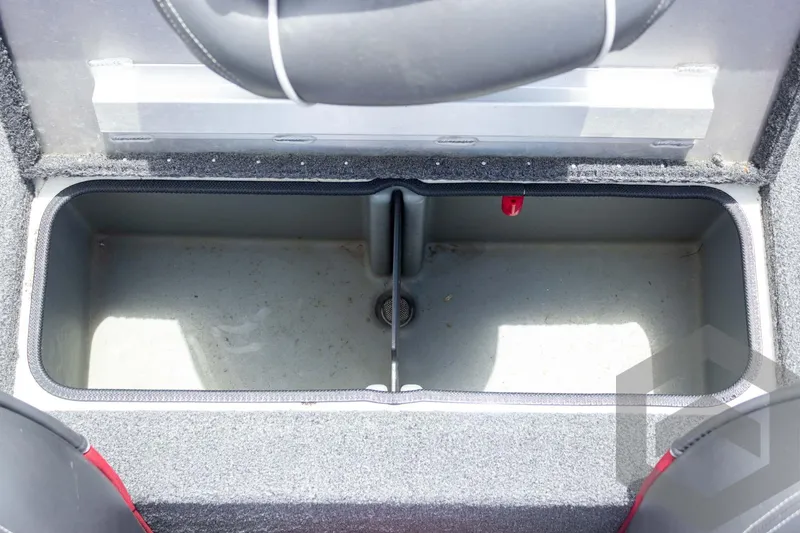Slide: The Image of 2019 Ranger RT188 boat storage compartment, open and empty, with gray interior and red accents. - 33