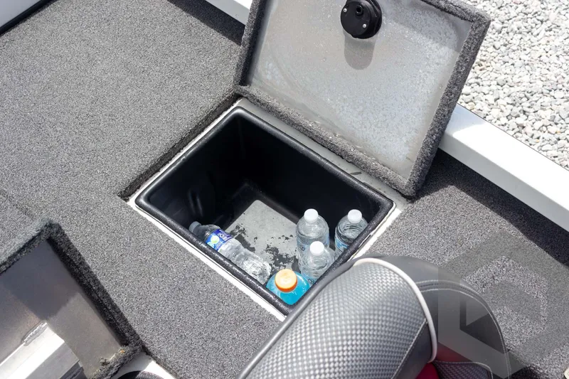 Slide: The Image of 2019 Ranger RT188 boat storage compartment with water bottles and drink cooler. - 35