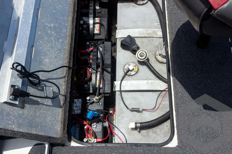 Slide: The Image of 2019 Ranger RT188 boat battery compartment with wiring and components. - 36