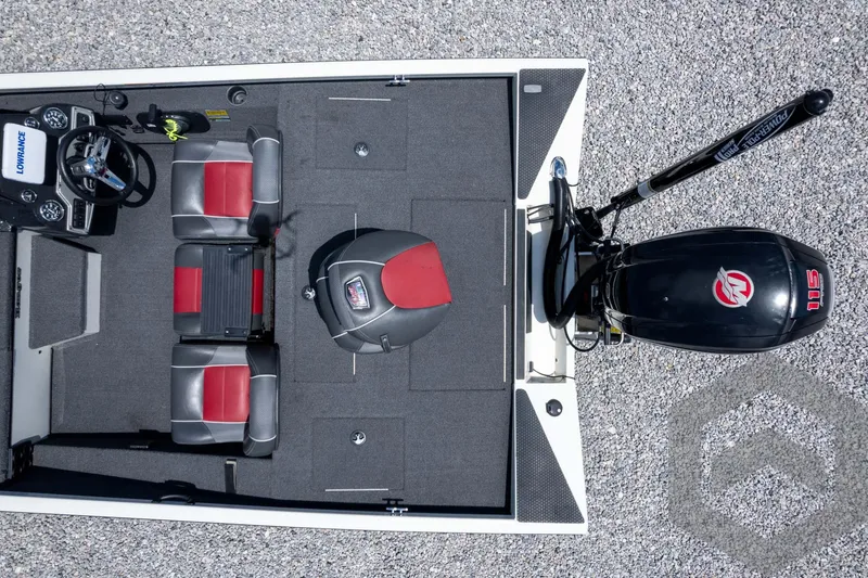 Slide: The Image of 2019 Ranger RT188 boat interior with red and gray seats, steering console, and outboard motor. - 40