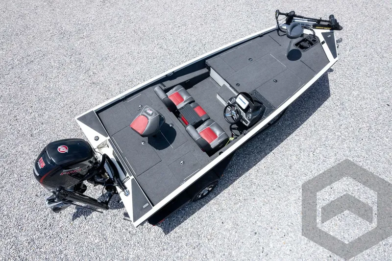 Slide: The Image of 2019 Ranger RT188 fishing boat with motor, dual seats, and spacious deck on gravel surface. - 44