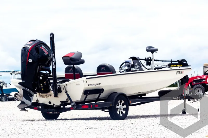 Slide: The Image of 2019 Ranger RT188 fishing boat on trailer, featuring outboard motor and seating. - 5