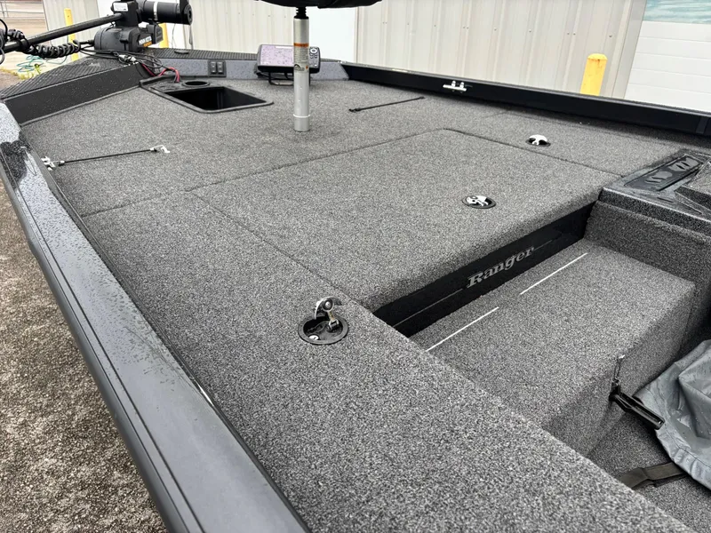 Slide: The Image of 2016 Ranger RT178 boat deck with storage compartments and fishing equipment. - 4