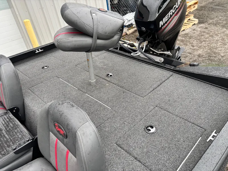 Slide: The Image of 2016 Ranger RT178 boat interior with Mercury engine, featuring gray seating and carpeted deck. - 9