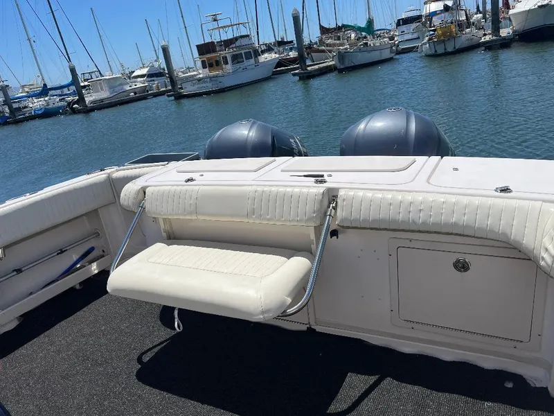 Slide: The Image of 2003 Grady-White 33 Express boat with seating, docked at marina. - 15