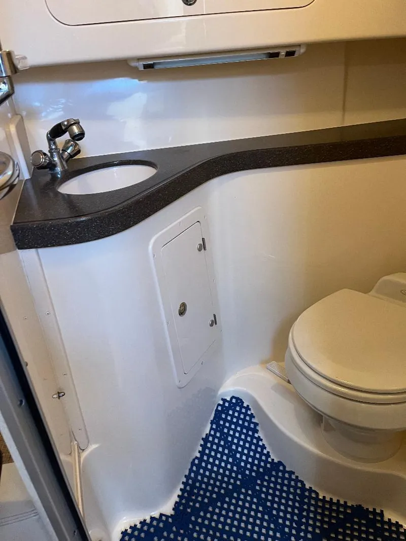 Slide: The Image of 2003 Grady-White 33 Express boat bathroom with sink and toilet. - 20