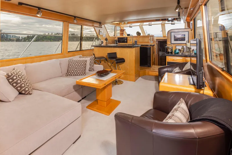 Slide: The Image of Luxurious interior of a 1989 Ocean Alexander 50 Sedan yacht with comfortable seating and elegant decor. - 11