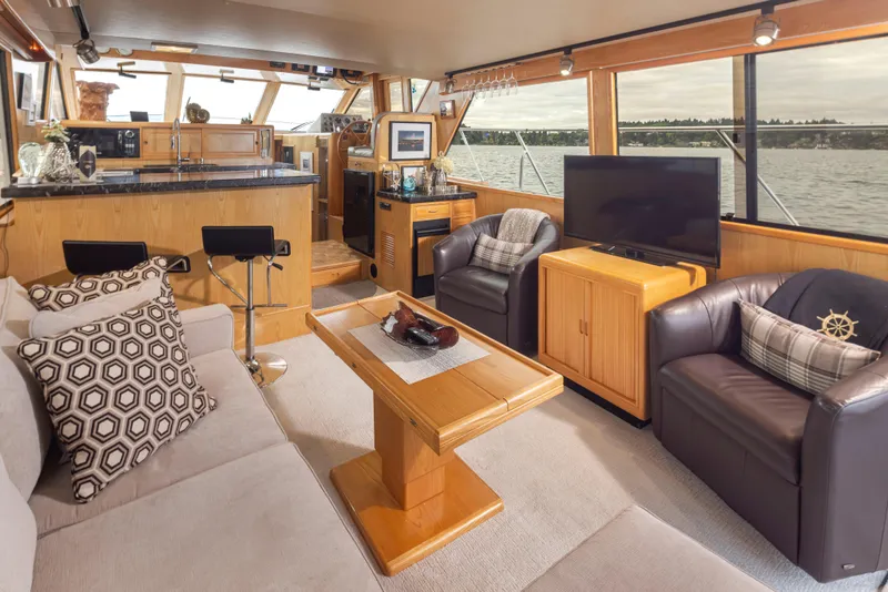 Slide: The Image of Luxurious interior of 1989 Ocean Alexander 50 Sedan yacht with modern furnishings. - 13