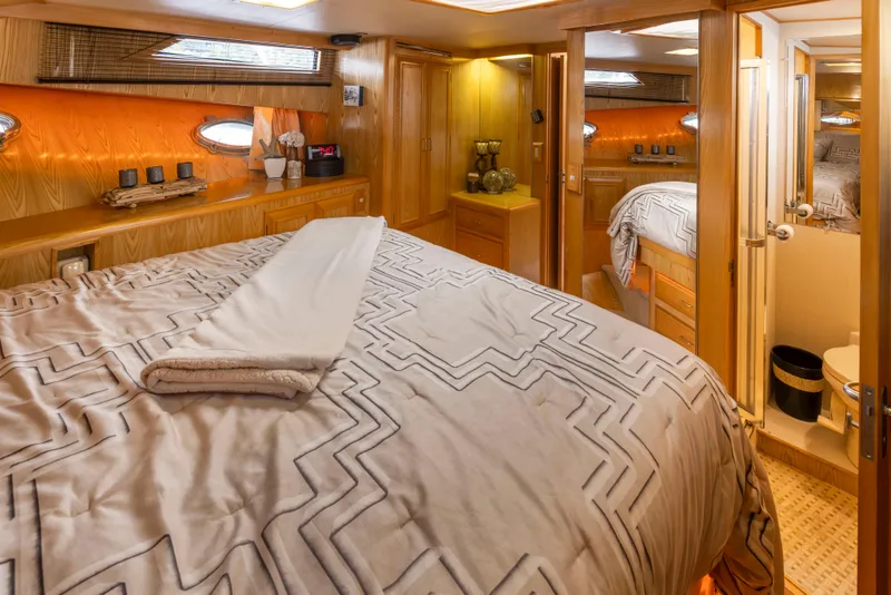 Slide: The Image of Luxurious cabin interior of 1989 Ocean Alexander 50 Sedan yacht with cozy bedding. - 19