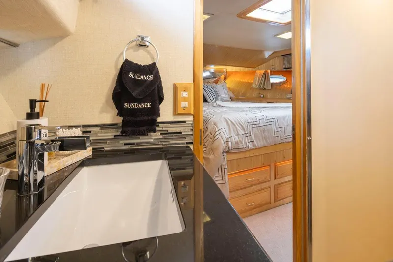 Slide: The Image of Luxurious bathroom and bedroom interior of 1989 Ocean Alexander 50 Sedan yacht. - 22