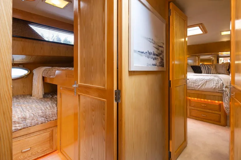 Slide: The Image of Interior of 1989 Ocean Alexander 50 Sedan yacht with cozy wooden cabin design. - 24