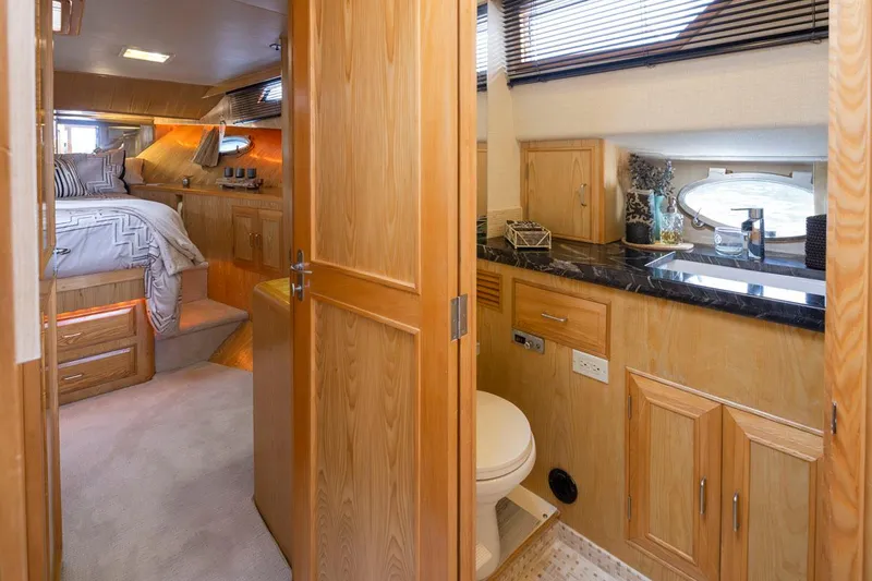 Slide: The Image of Interior of 1989 Ocean Alexander 50 Sedan yacht, featuring bedroom and bathroom. - 28