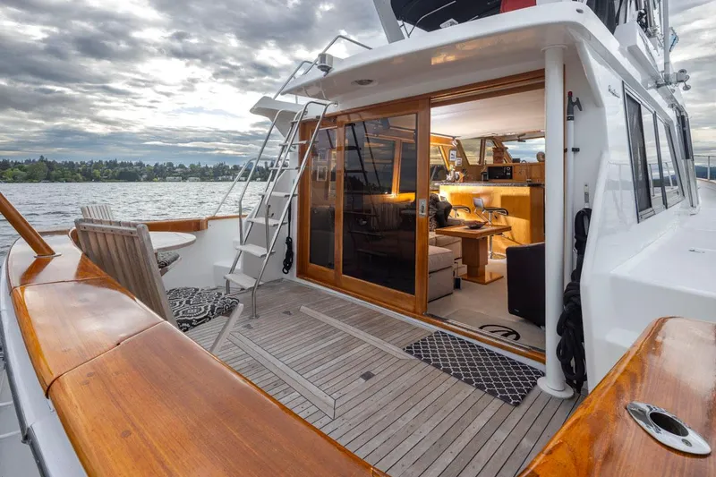 Slide: The Image of 1989 Ocean Alexander 50 Sedan yacht with wooden deck and open cabin view. - 30