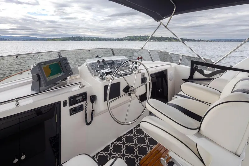 Slide: The Image of Cockpit of 1989 Ocean Alexander 50 Sedan yacht with steering wheel and navigation equipment. - 35